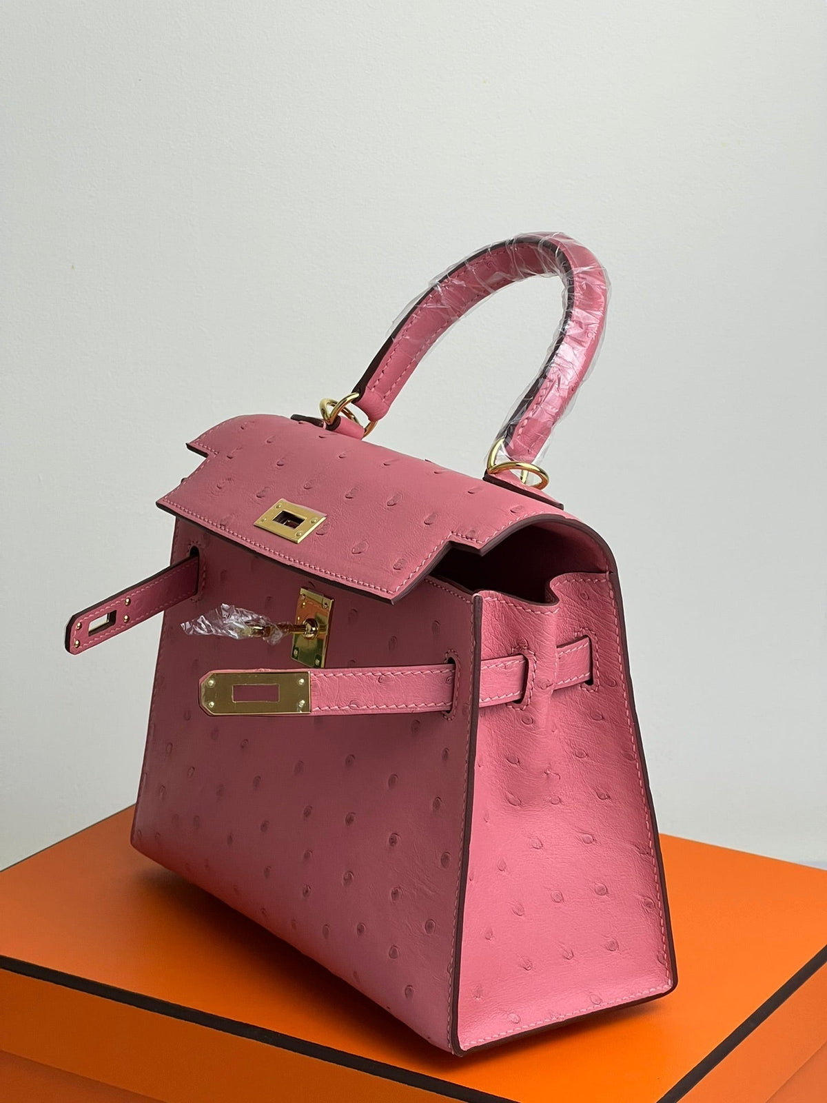 KELLY BAG 20 IN ROUGE PINK OSTRICH LEATHER WITH GOLD HARDWARE (MADE-TO-ODER)