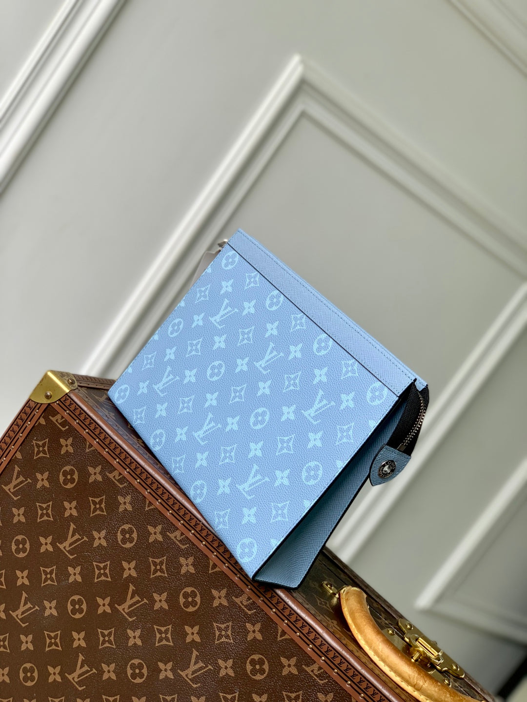 POCHETTE VOYAGE 26 IN LIGHT BLUE MONOGRAM ECLIPSE CALFSKIN